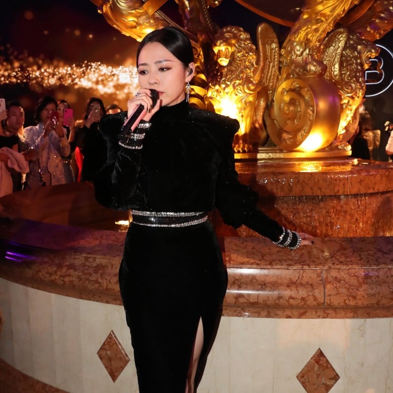 Chinese singer Jane Zhang dazzles in a black Balmain gown at Sands Macao Fashion Week Gala Dinner.