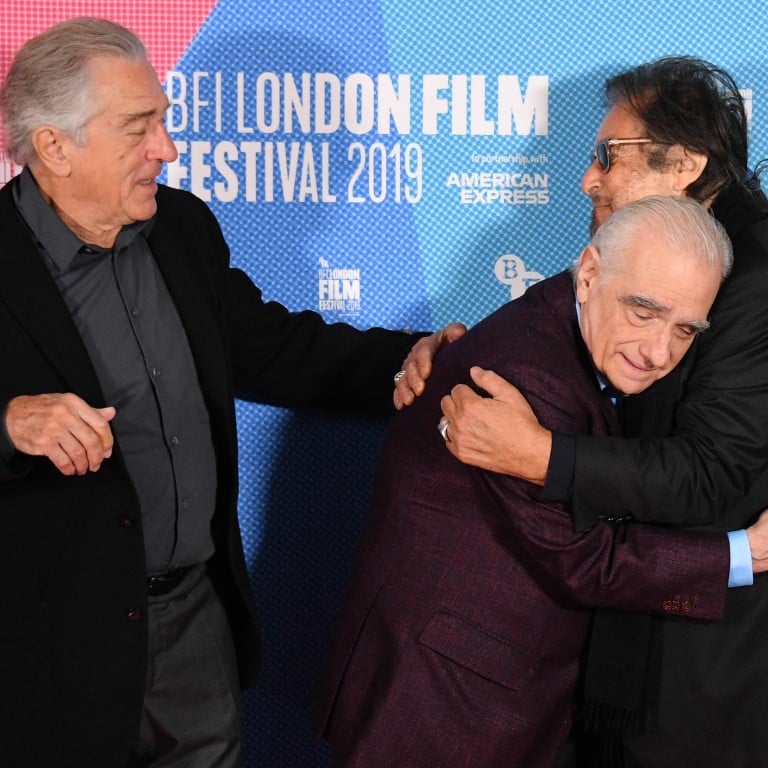 Legendary director Martin Scorsese embraces iconic actor Al Pacino, while titanic contemporary Robert De Niro looks on, at an official photo call for The Irishman during the BFI London Film Festival 2019. Photo: AFP