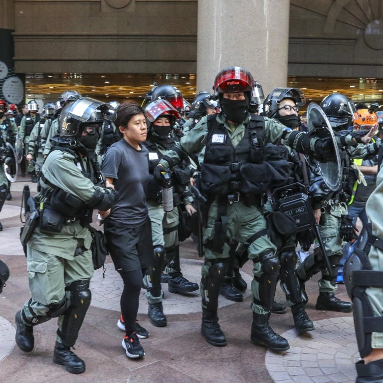 Police conduct ID checks and make arrests at Times Square in Causeway Bay. Photo: May Tse
