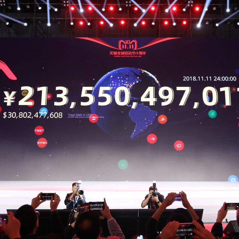 The total figure spent is displayed on the big screen in Shanghai during the 11.11 Global Shopping Festival in 2018, when a new record was set – and is likely to be broken in 2019. Photo: Simon Song