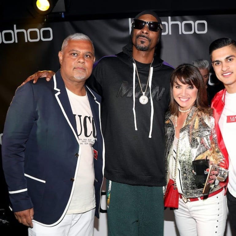Mahmud Kamani (left) with rapper Snoop Dogg, business partner Carol Kane, and his son, Samir. Photo: Getty Images