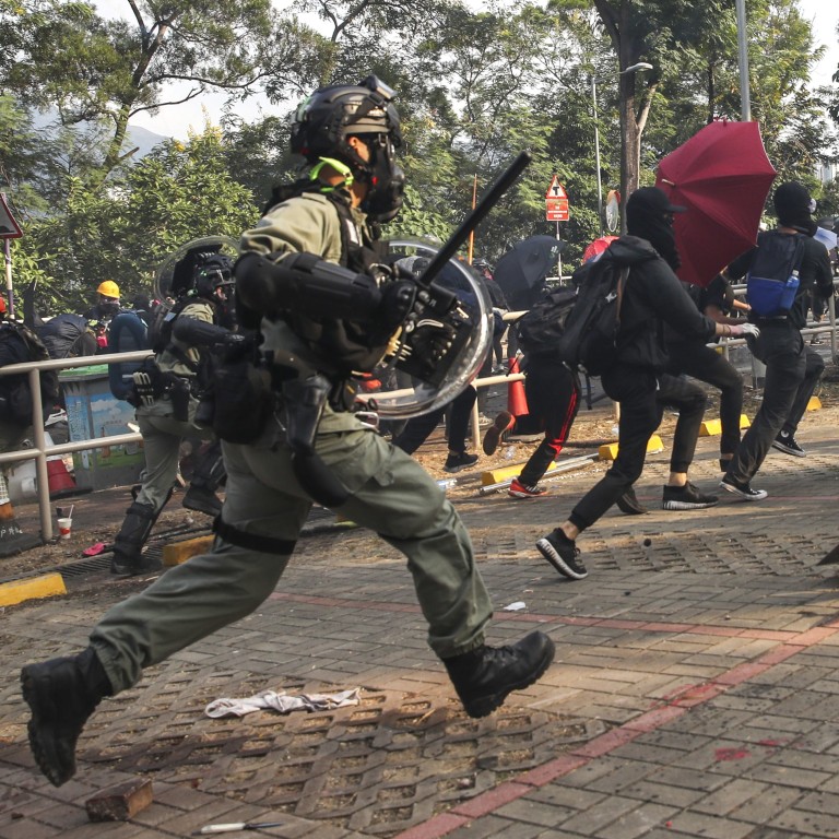 Clashes erupt between anti-government protesters and riot police as they fire tear gas into the campus and make arrests at the Chinese University of Hong Kong on Tuesday. Photo: Winson Wong