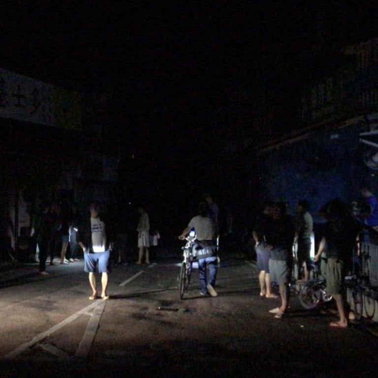 Residents in the dark amid the blackout in Shek O. Photo: Amanda Johnstone