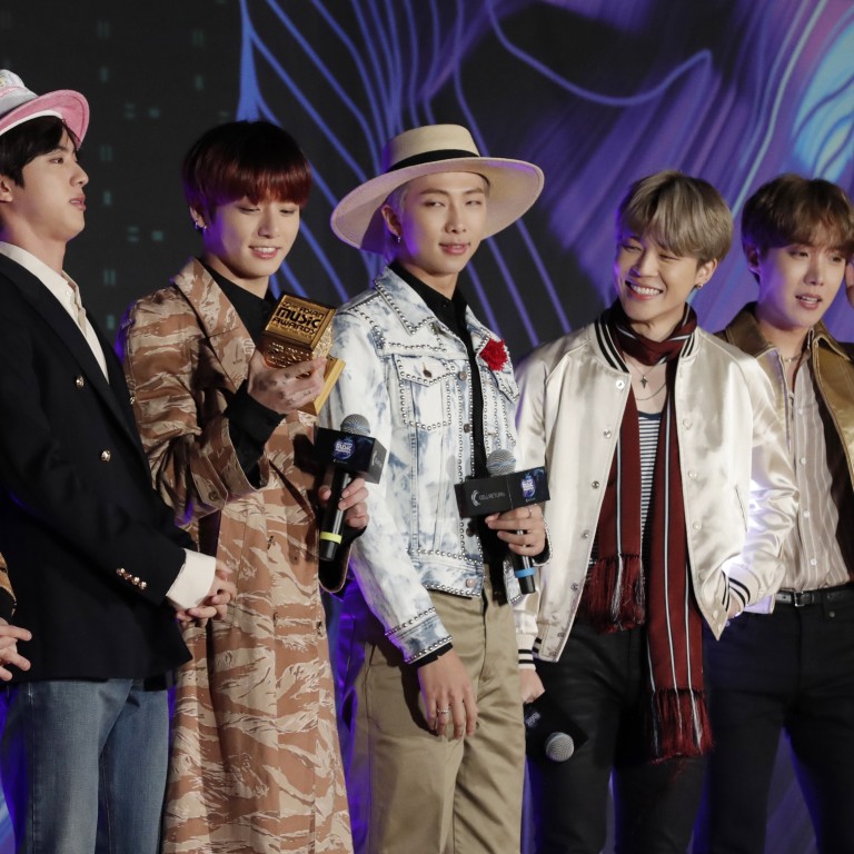 Members of the band BTS receive the award for best music video for the single Boy with Luv, at the Asian Music Awards in Nagoya, Japan, on Wednesday, December 4. But who looked the slickest onstage? Photo: AP