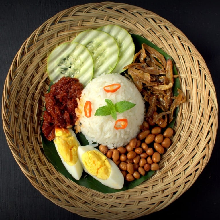 The Southeast Asian dish of nasi lemak consists of rice cooked in coconut milk with the addition of pandan leaf, served with a selection of accompaniments, such as peanuts, boiled egg and cucumber, and a spicy sambal (paste or sauce).