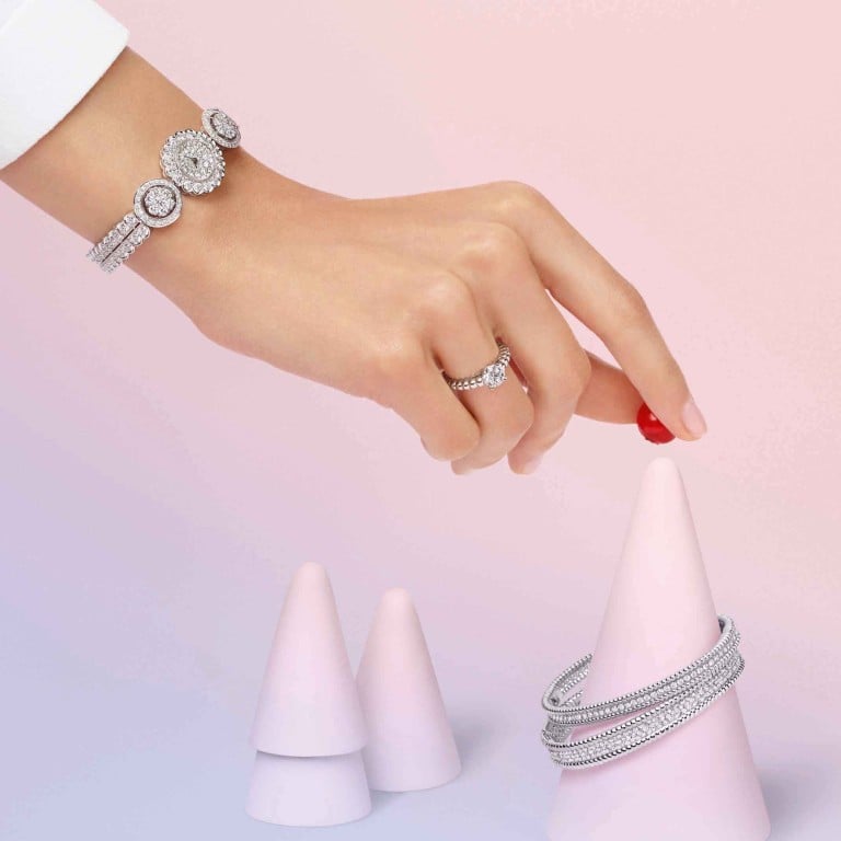 Snowflake watch in platinum, white gold and diamonds; a Perlée solitaire in white gold and diamond; a Perlée diamond bracelet, one row, white gold, diamonds; and a Perlée diamond bracelet, three rows, white gold, diamond from the Diamond Breeze collection. Photo: Van Cleef & Arpels