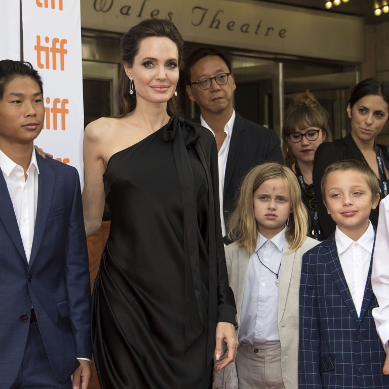 From left, Maddox Chivan Jolie-Pitt, Pax Thien Jolie-Pitt, Angelina Jolie, Vivienne Marcheline Jolie-Pitt, Knox Leon Jolie-Pitt and Shiloh Nouvel Jolie-Pitt attend the Toronto International Film Festival in Canada. Photo: Valerie Macon/AFP