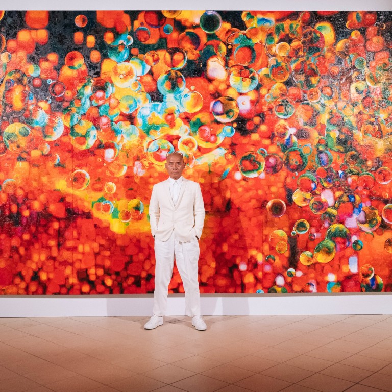 Chinese artist Zhang Huan with his artwork Eaux-de-Vie. Photo: Hennessy