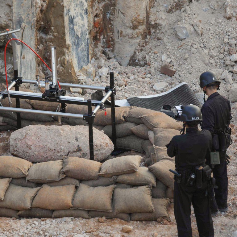 Wartime bomb unearthed in Hong Kong defused in 12hour police operation
