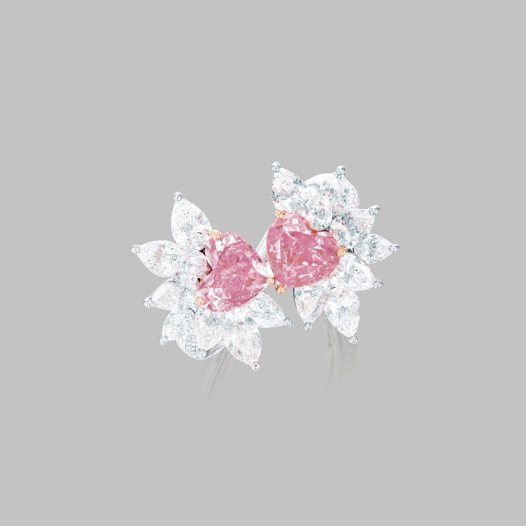 Fancy vivid purplish pink diamond, fancy intense purplish pink diamond and white diamond earrings. Photos: Phillips