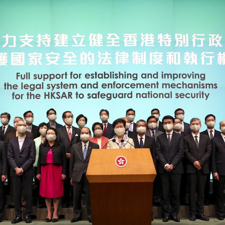 Hong Kong Chief Executive Carrie Lam (centre) has vowed to “fully cooperate” with Beijing over a national security law for the city. Photo: Xiaomei Chen