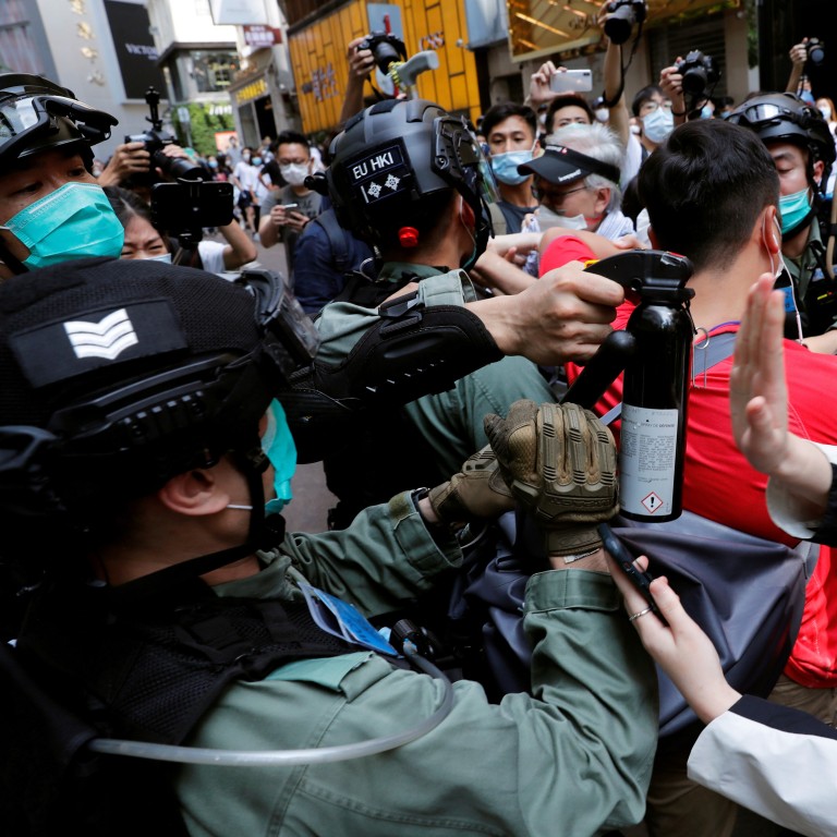 Protesters and police clash on May 27 as activists take to the streets against the national security law. Photo: Reuters