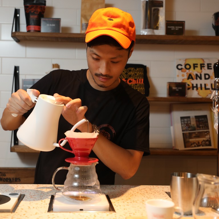 Coffee roaster Anson Wong makes a pour-over coffee at Elephant Grounds in Causeway Bay. Photo: Chen Xiaomei