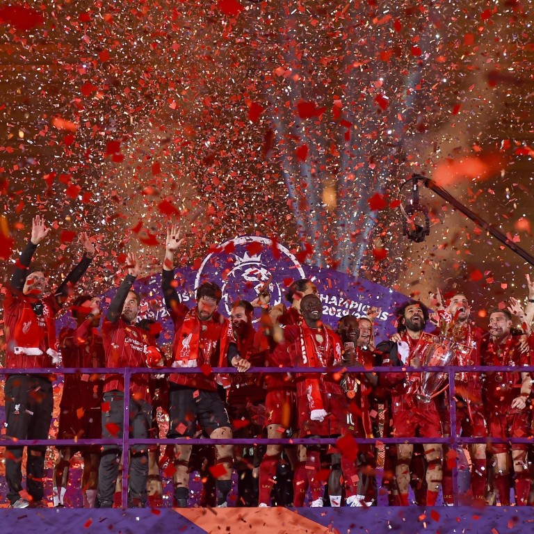 Liverpool Players Receive Long Awaited Premier League Trophy On Kop South China Morning Post