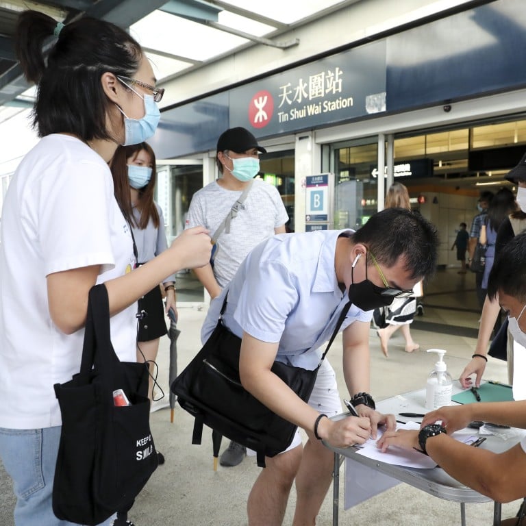 Opposition activists collect support from registered voters ahead of nomination deadline for the Legislative Council elections. Photo: Edmond So