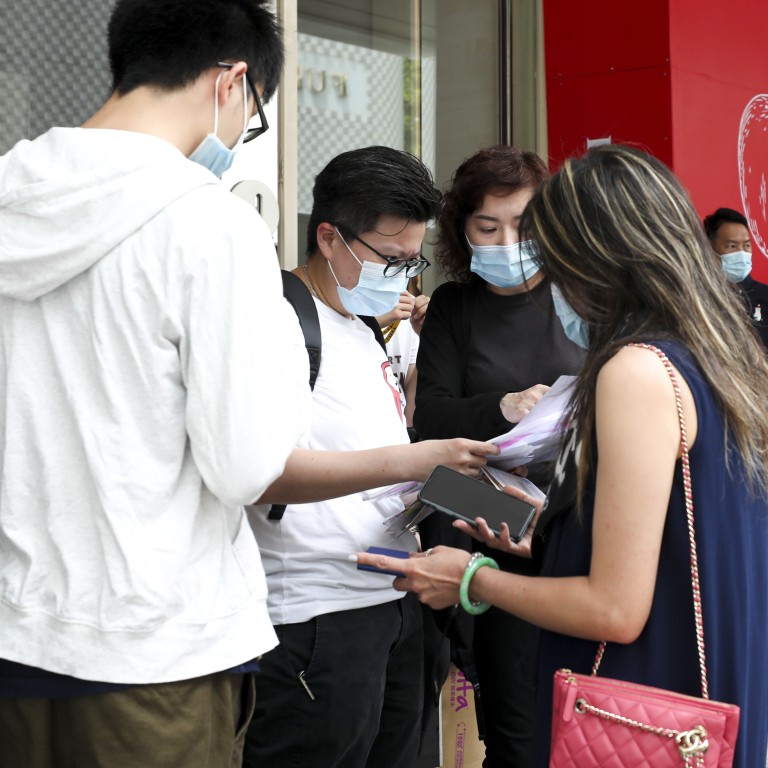 Potential buyers line up at the sales office of Henderson Land Development’s Seacoast Royale project in Tuen Mun on 1 August 2020 to bid for the first 185 flats at the project. Photo: Xiaomei Chen