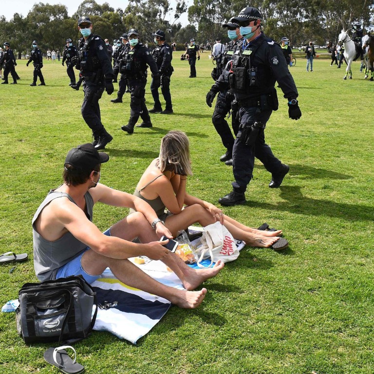 Police sweep through a park to break up an anti-lockdown protest in Melbourne on Saturday. Photo: AFP