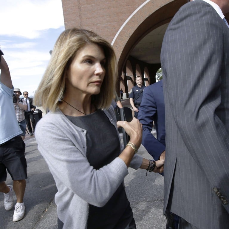 Actress Lori Loughlin reports to California prison to begin sentence