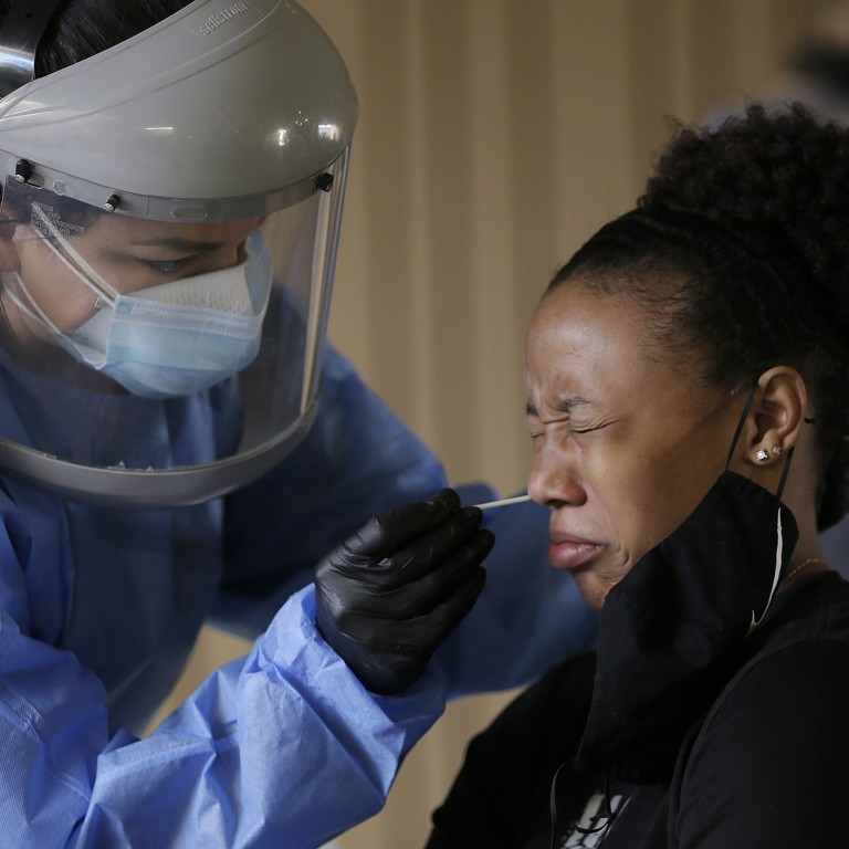 A student at the University of Texas at El Paso has a coronavirus test. People in El Paso have been instructed to stay home for two weeks after cases rose, overwhelming hospitals. Photo: AP