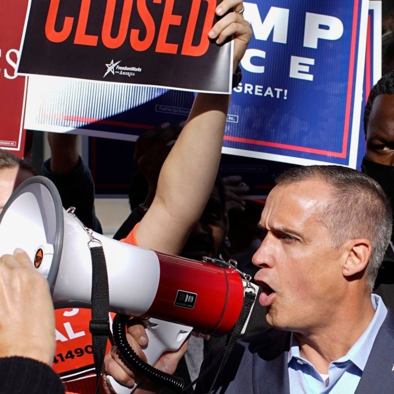 Trump campaign adviser Corey Lewandowski (centre), with former Florida attorney general Pam Bondi (right), speaks outside the Pennsylvania Convention Centre on November 5. Photo: AFP