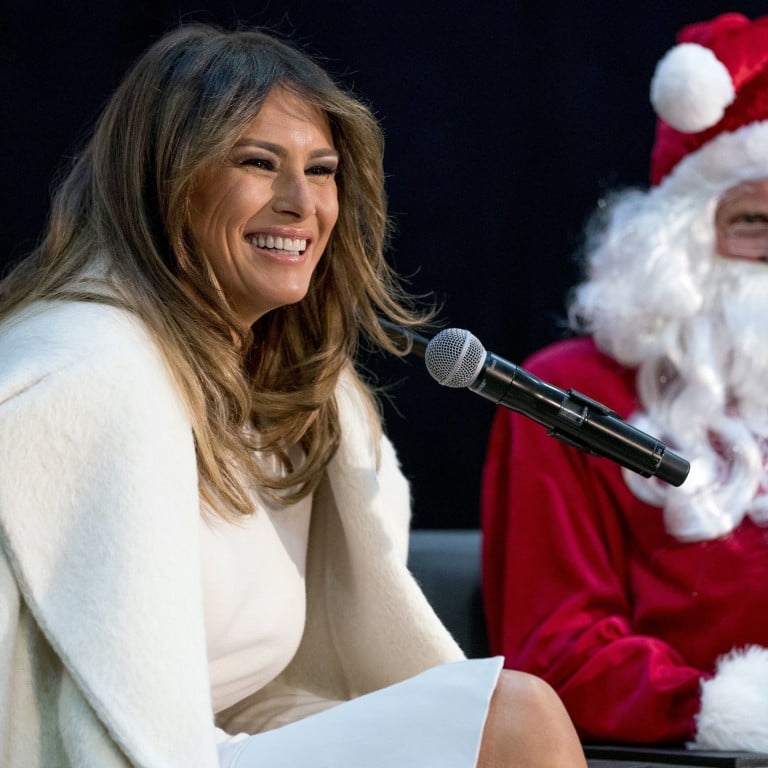 First lady Melania Trump, accompanied by Santa Claus, takes questions from children at Washington’s Children's National Medical Center in December 2017. Photo: AP Photo