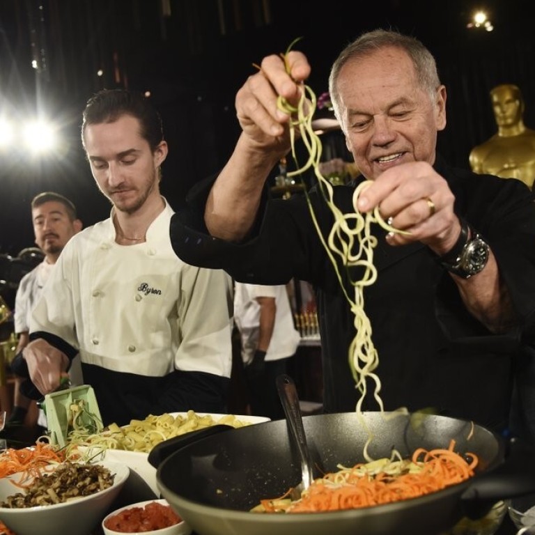 Chef Wolfgang Puck and his son Byron make a pasta dish at the Governors Ball Press Preview for the 92nd Academy Awards in Los Angeles on January 31, 2020. Photo: AP Photo