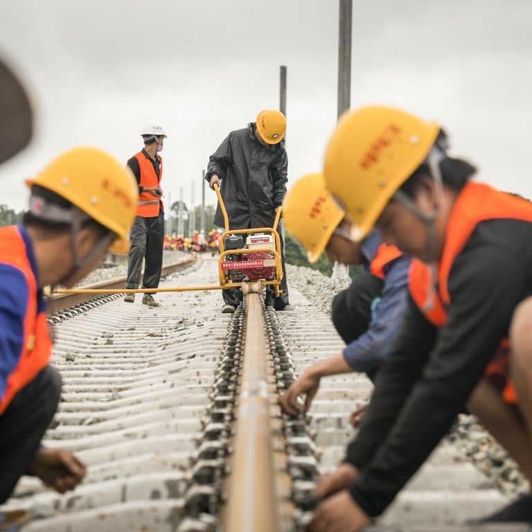 Workers weld the first seamless rails for the China-Laos railway, in Vientiane, on June 18, 2020. Photo: Xinhua