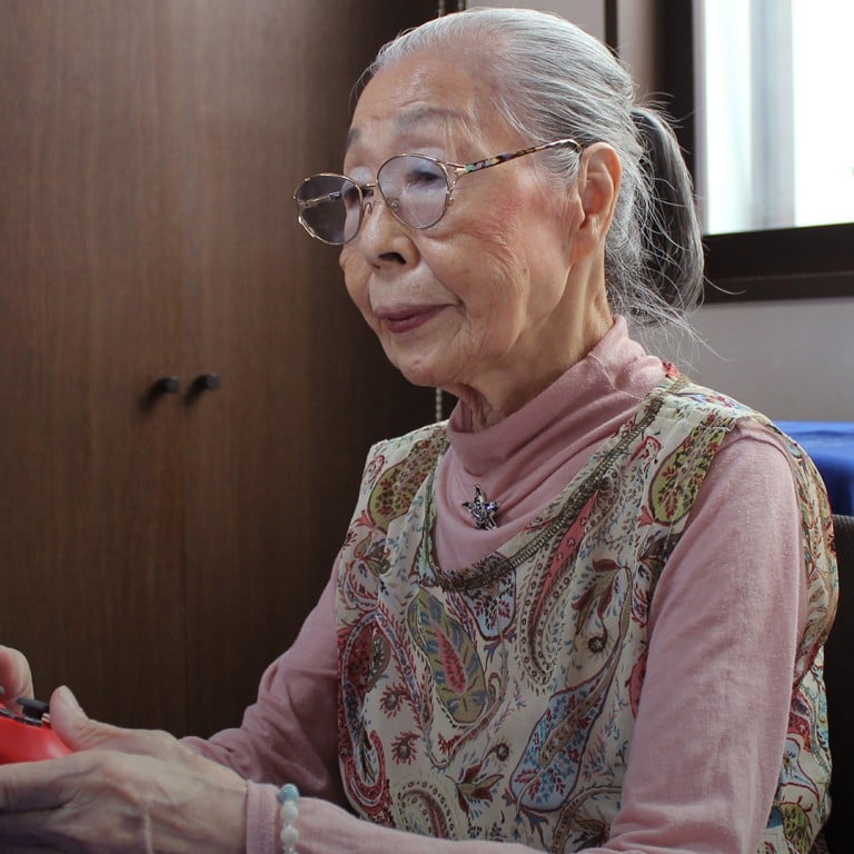 90 year old Japanese grandma flexes fingers for video gaming