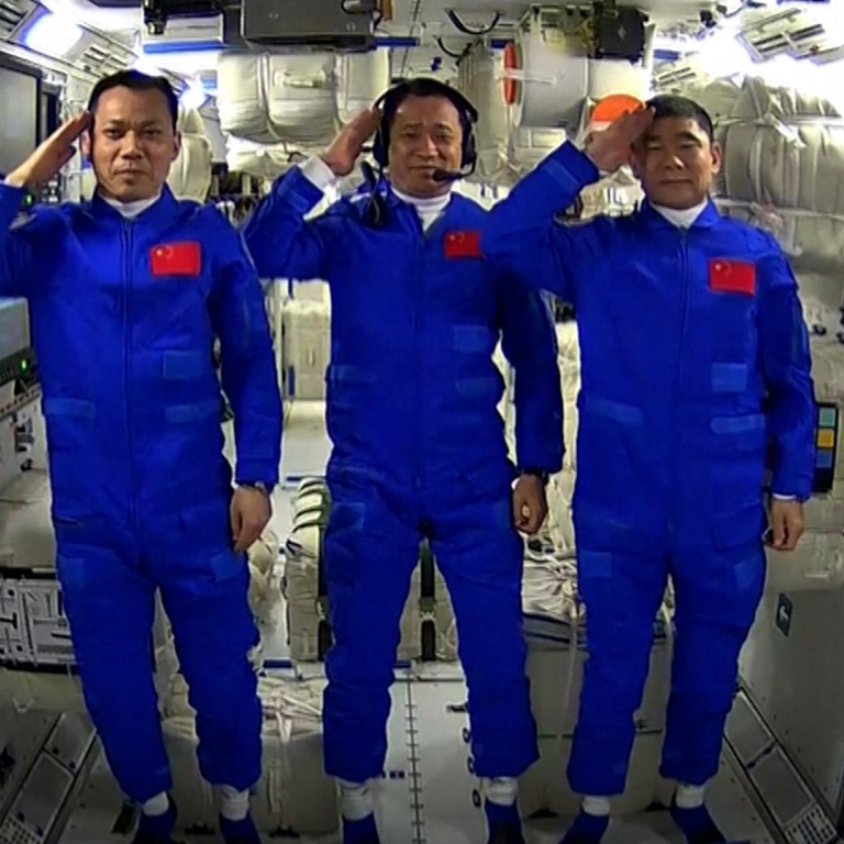 Chinese astronauts explore space station that will be their home for three months