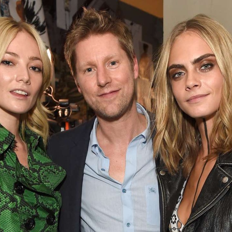 Clara Paget, Christopher Bailey and Cara Delevingne looking chic in Burberry at the September show.