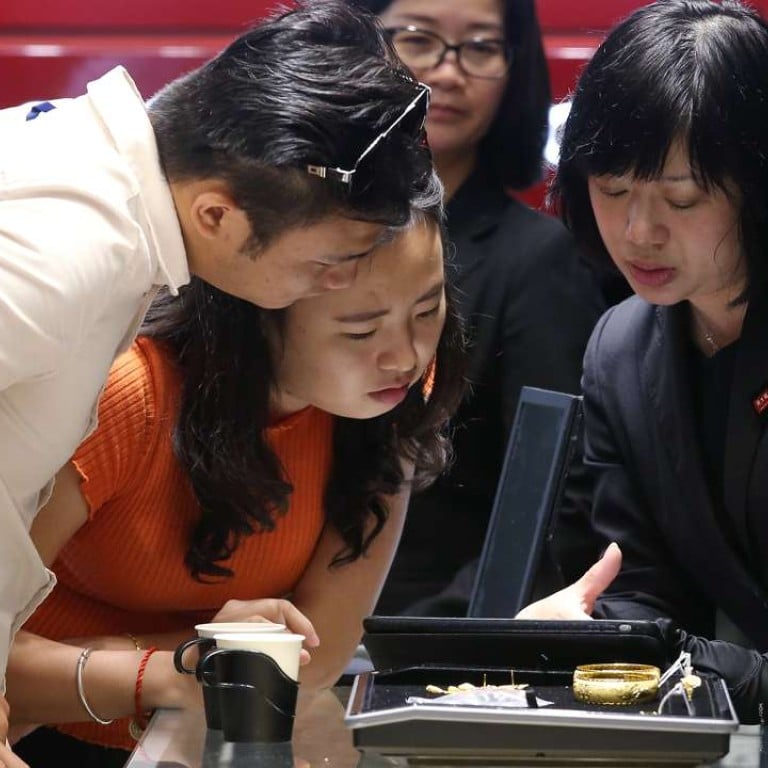 Customers are more cautious about buying jewellery. Photo”: K. Y. Cheng