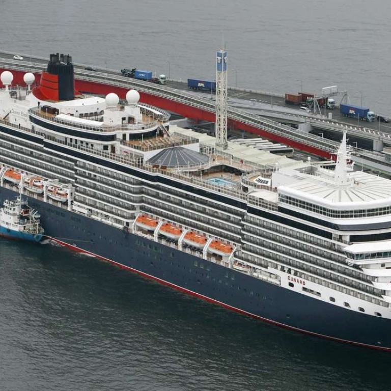 Luxury liner Queen Elizabeth arrives at the port of Kobe, Japan, on March 13, 2017. The 90,901-ton cruise ship is on an around-the-world voyage. The photo was taken from a Kyodo News helicopter. (Kyodo) ==Kyodo