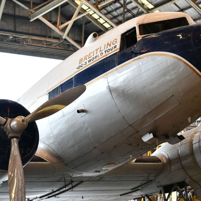 Twin-engine propeller-driven Breitling DC-3 at Macau International Airport.