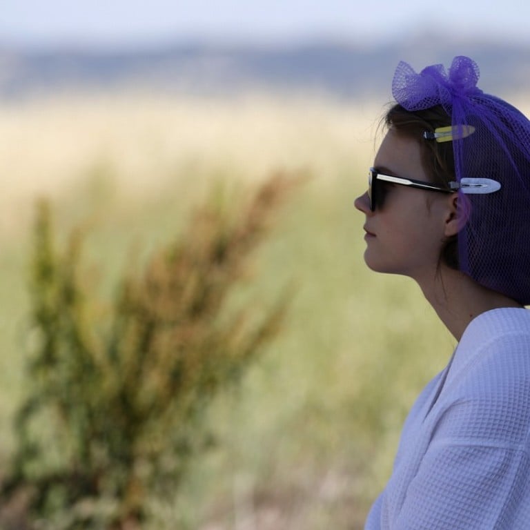 A model steps outside before the Dior Cruise 2018 Collection runway show. Photo: REUTERS