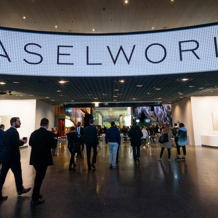 Visitors enter during the press day of Baselworld watch and jewellery show on March 22, 2017 in Basel. Photo: AFP