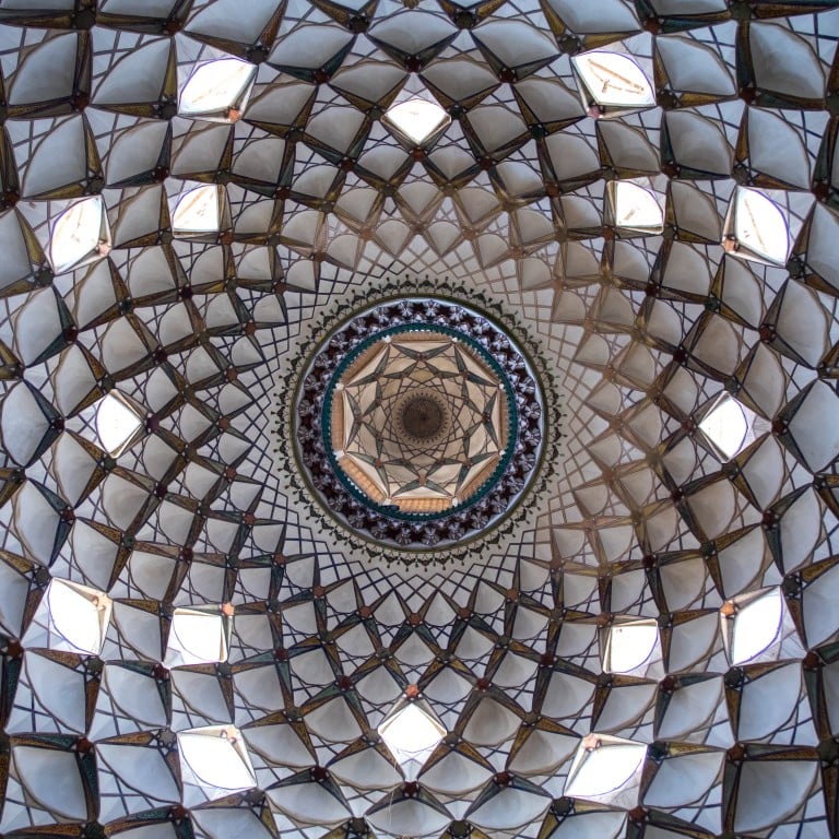A beautifully adorned ceiling of the hall in Boroujerdi historical house, Isfahan Province, Kashan, Iran. Photo: Getty