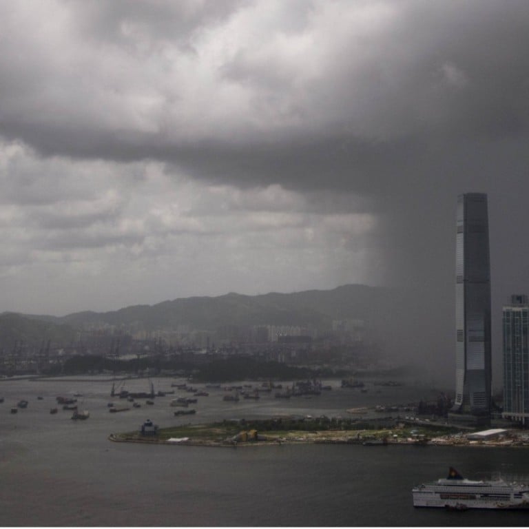 Rain clouds approach the International Commerce Centre (ICC) in Hong Kong. Photo: AFP
