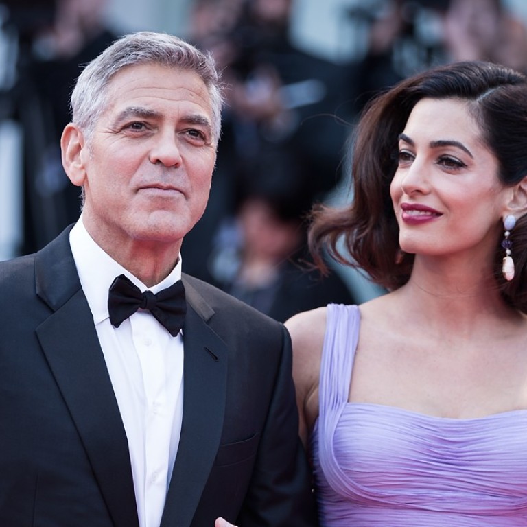 Director George Clooney and his wife Amal attend the premiere of the movie ‘Suburbicon’ in competition at the 74th Venice Film Festival. Photo: Xinhua