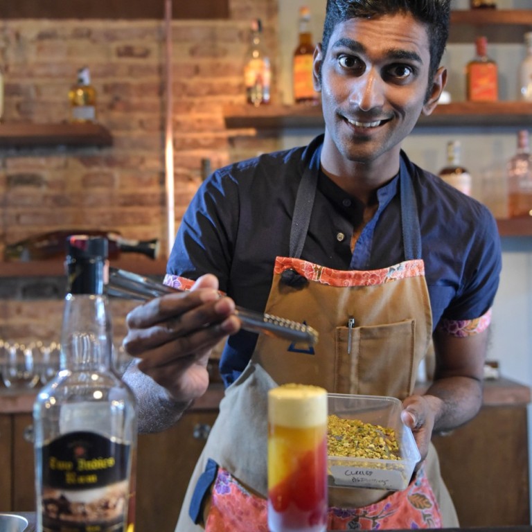 Mr Vijay Mudaliar, head bartender of Native, preparing a Mango Lassi, which includes hand-pureed Indian mangoes, Amrut Old Port rum, beetroot jelly, pomegranate molasses and pistachios.