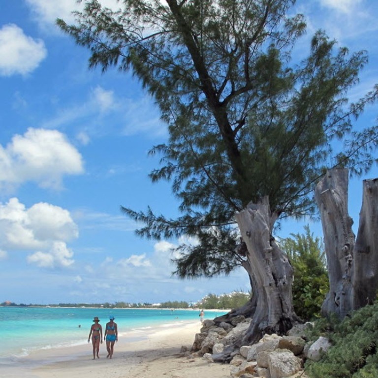 Tourists can still book winter holidays to many Caribbean islands, including Grand Cayman Island. Photo: AP