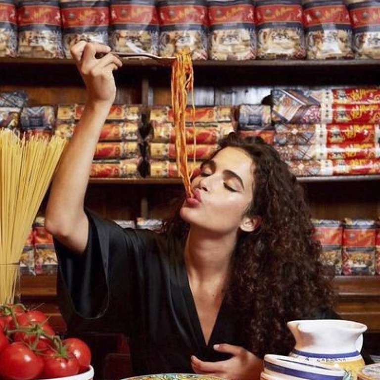 The chiffon dress with the pasta print should have been the tipoff