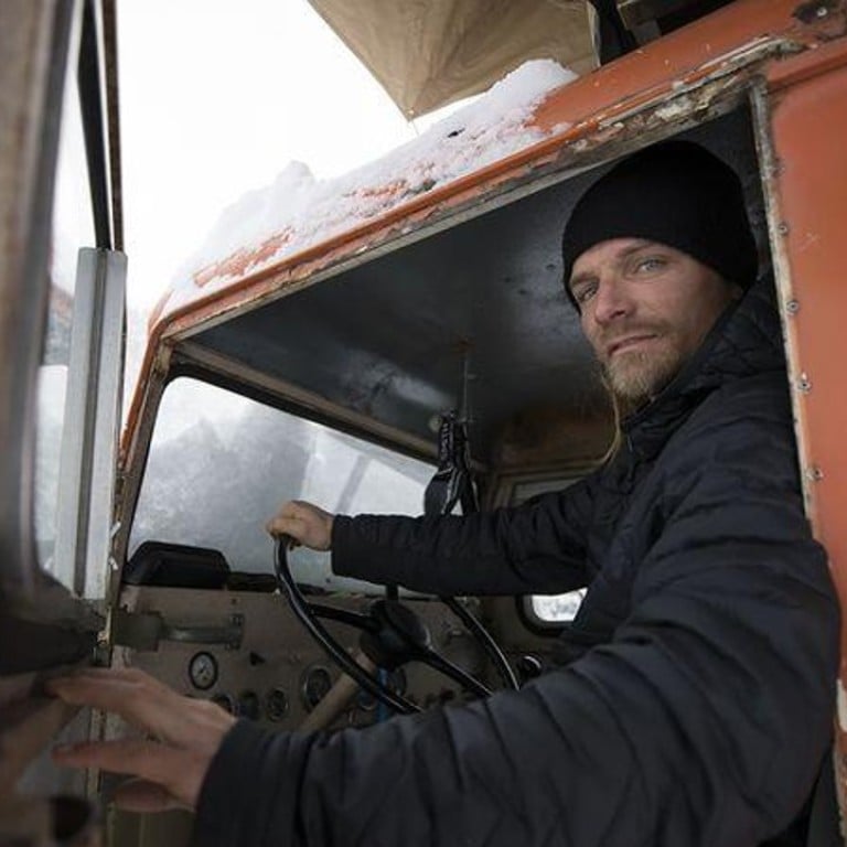Skier Mark Abma uses his vintage Tucker as a base camp and scenic prop for performing tricks. Photographer: Mark Welsh