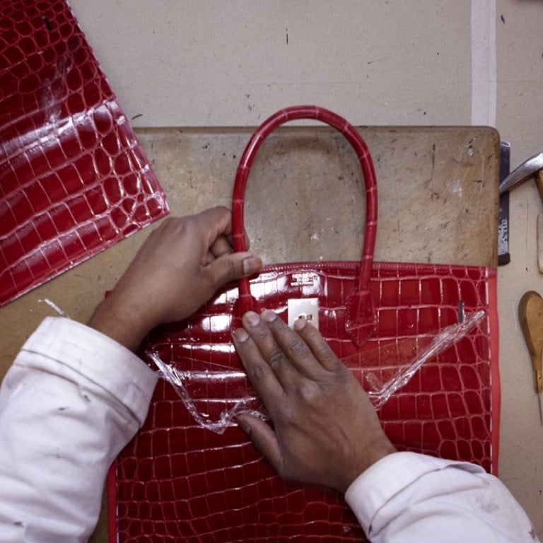 An artisan working at Hermès leather atelier