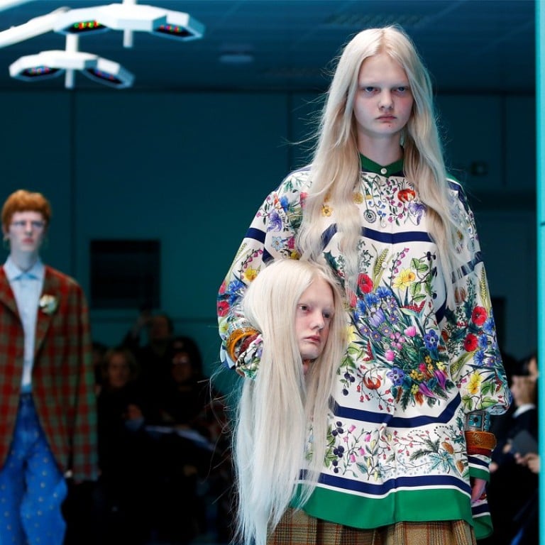 A model presents a creation from the Gucci Autumn/Winter 2018 women collection during Milan Fashion Week in Milan, Italy February 21, 2018. REUTERS/Tony Gentile