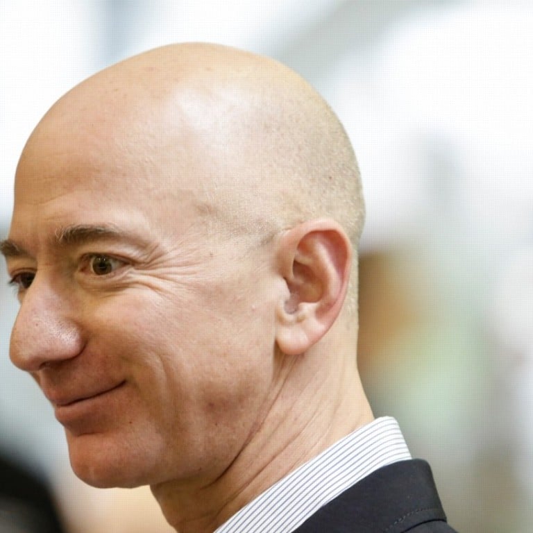 Jeff Bezos, CEO of Amazon, tours the facility at the grand opening of the Amazon Spheres in Seattle, Washington, in January. Bezos is officially the richest person on the planet thanks to the success of Amazon. Photo: AFP
