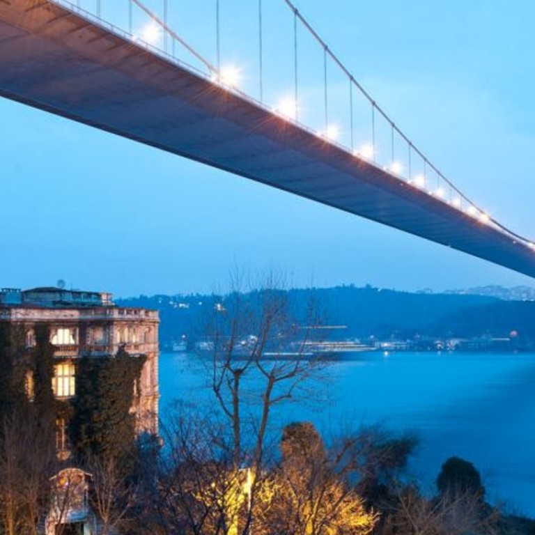 The five-storey home sits under the Fatih Sultan Mehmet Bridge in Istanbul, which connects the European and Asian sides of Turkey. Photo: Caters News Agency