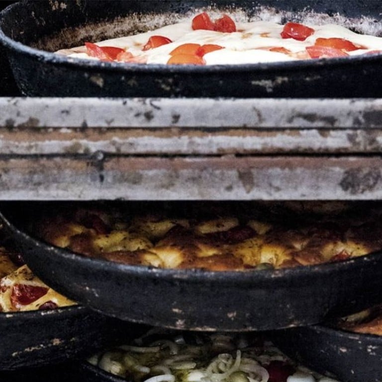 Pizzas at Di Gesù, a popular bakery in Altamura, Puglia. Photo: Carol Sachs for Bloomberg Businessweek