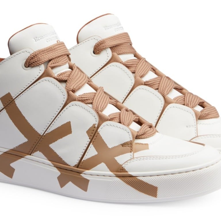 Ermenegildo Zegna. These chic and minimalist Off-white Tiziano XXX high-top sneakers, in smooth calfskin, are designed with a painted beige triple X on the side, and a hand-stitched triple X on the heel tab, HK$9,750