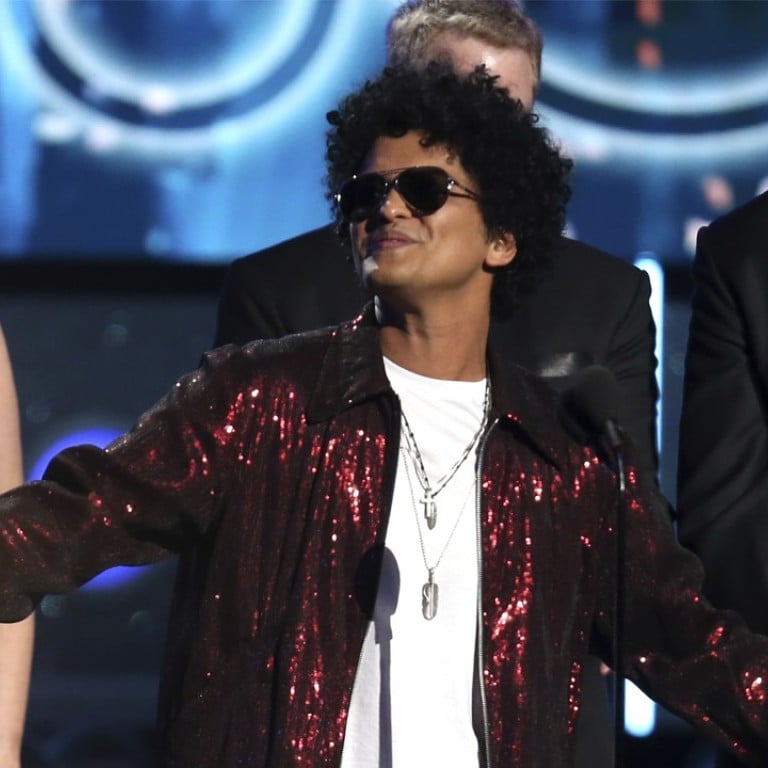 Bruno Mars (centre), who won a Grammy award for his album, ‘24K Magic’, will be performing his 24K Magic World Tour show on the day of qualifying, at this year’s United States Grand Prix in Austin Texas, on October 20.