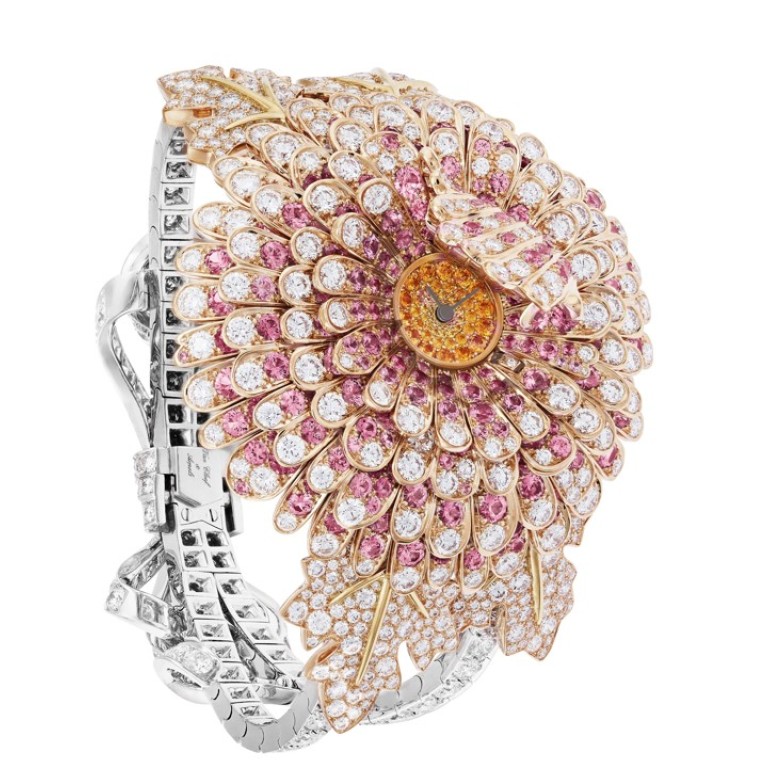 Van Cleef & Arpels’ Chrysanthème Secret watch is made of diamonds, pink sapphires, and spessartite garnets.
